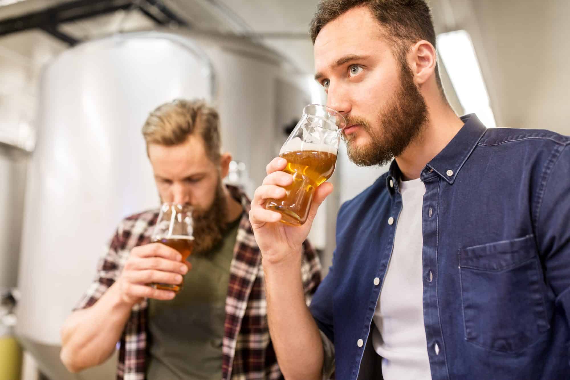 Two men tasting beer at brewery to represent Craft Beer Tour Chicago.