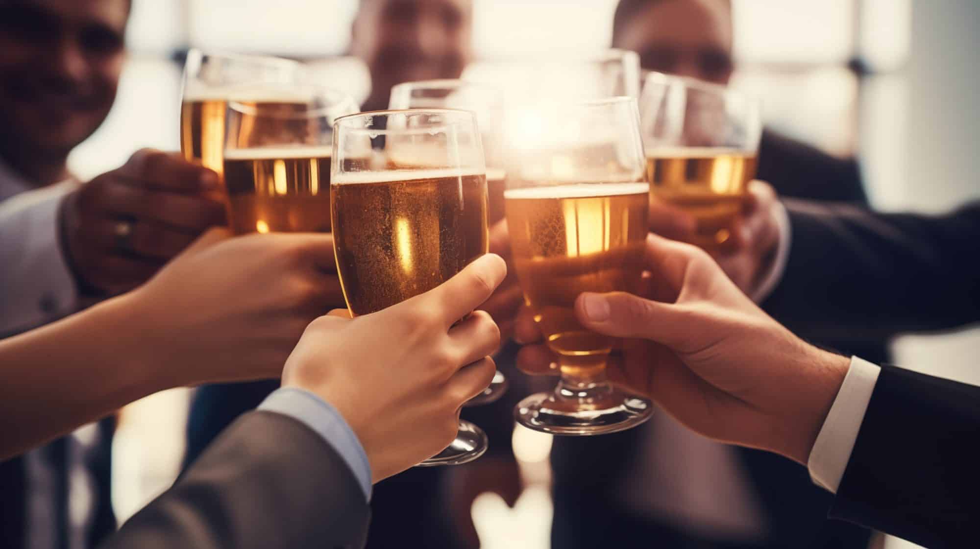 A group of people raise glasses filled with beer in a celebratory toast at a Corporate Event in Chicago