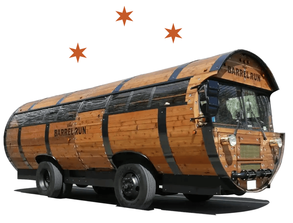 side angle of The Barrel Run bus with stars