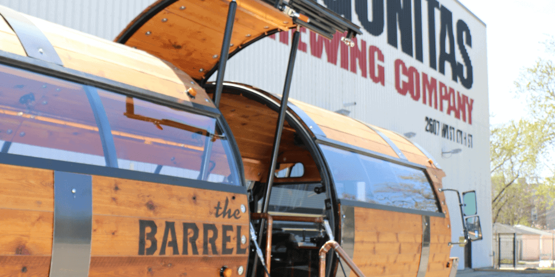 side angle of the barrel bus with Lagunitas Brewing in the background