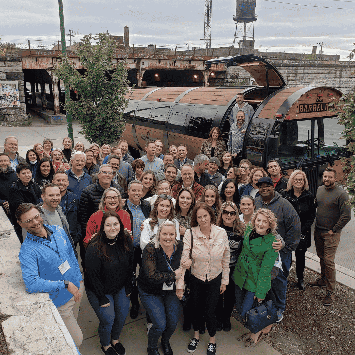 group of people standing in front of The Barrel Run bus in Chicago on a corporate outing