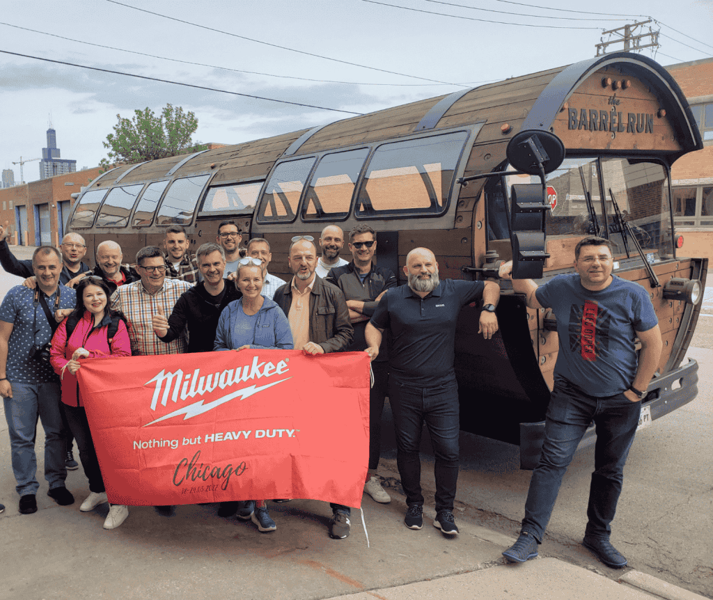 group of people holding a Milwaukee Chicago sign on a private tour with the Barrel Run